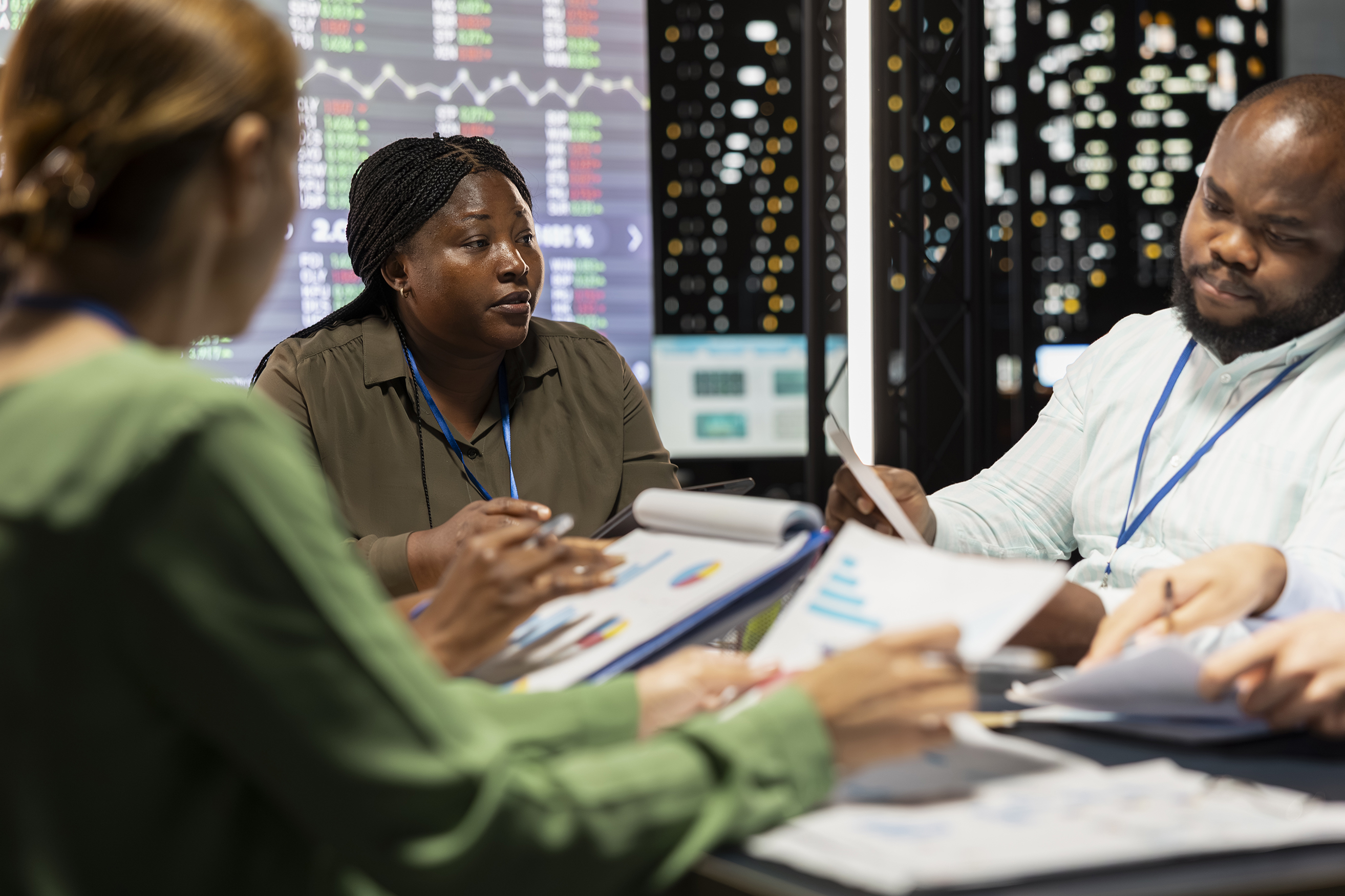 Professionals analyzing charts and graphs